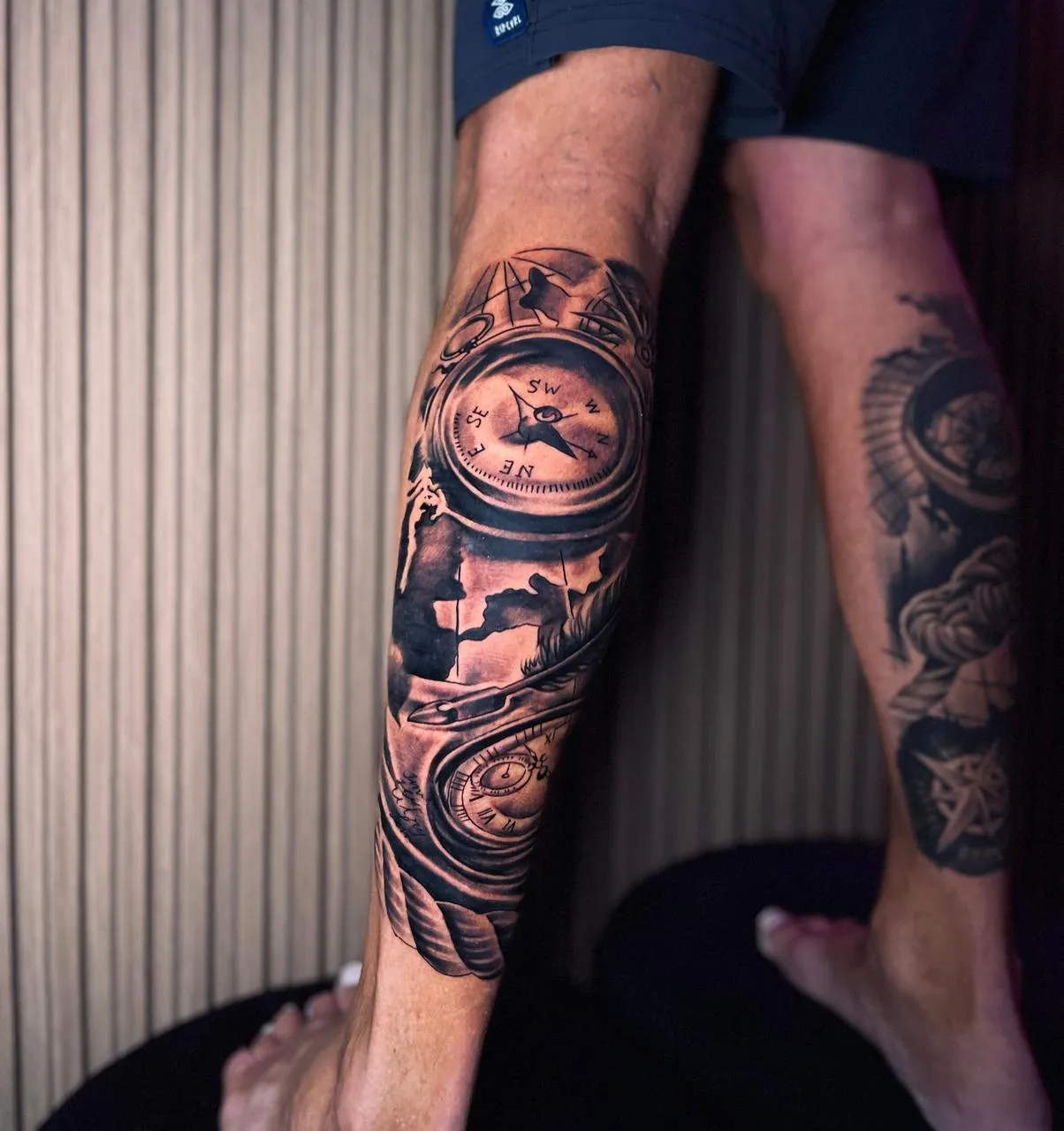 Intricate tattoo of a compass design.