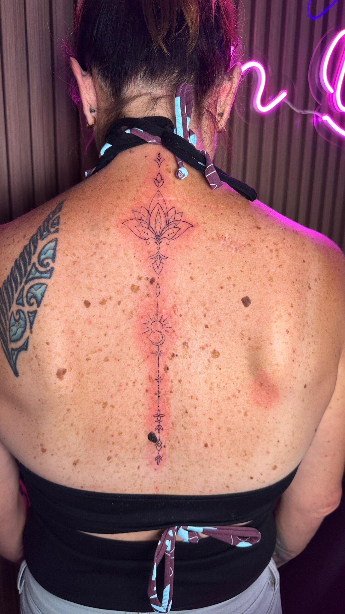 Back tattoo with floral design.