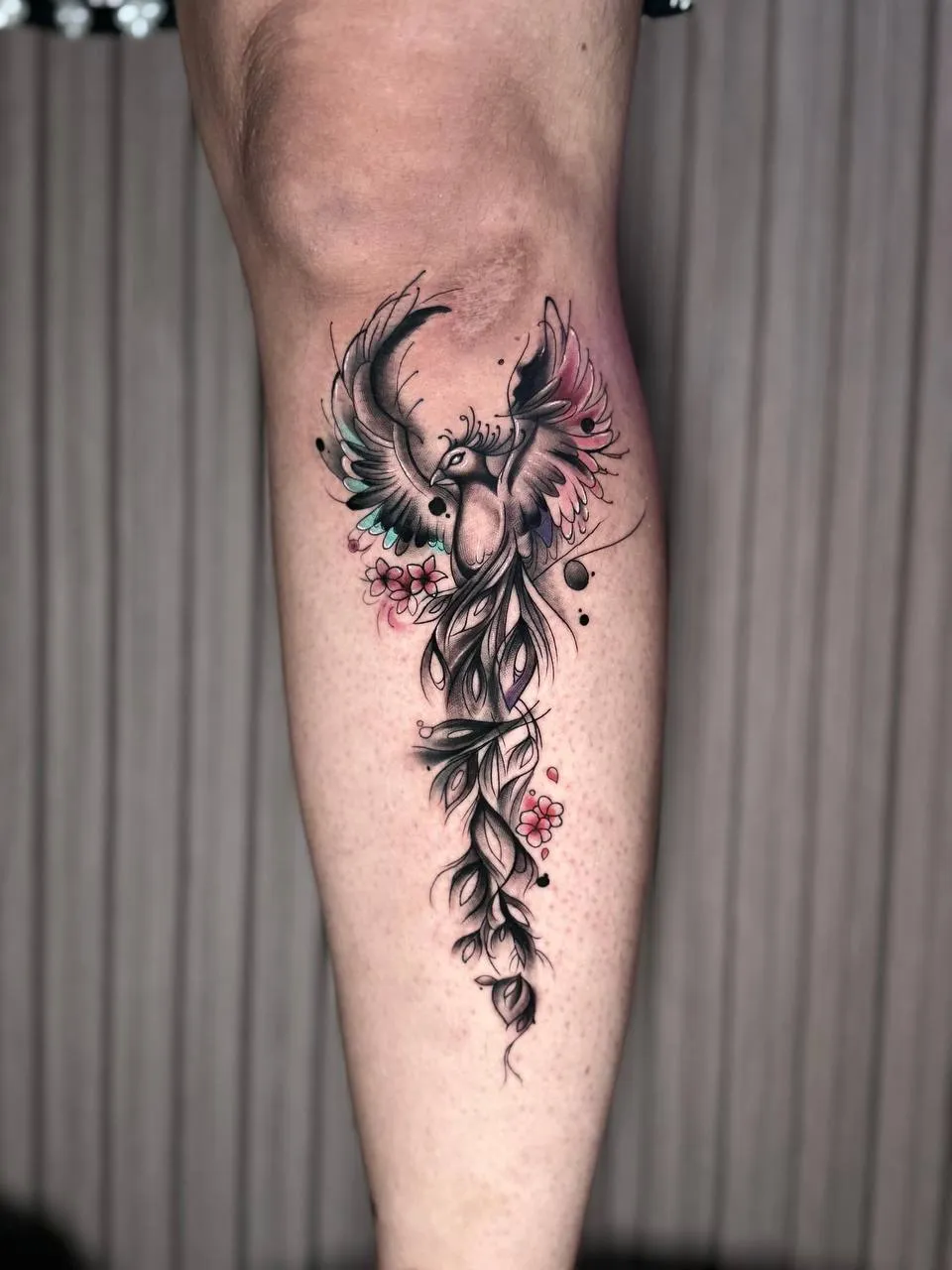 Colorful phoenix tattoo on leg